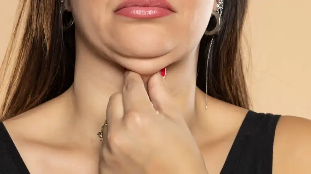 An image of a woman with double chin, sad, worried : Non Surgical Double Chin Removal Treatment in Hucknall, UK